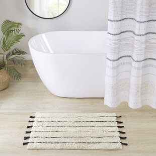 cambridge round tufted bath mat with tassels